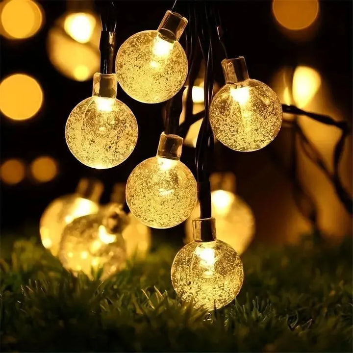 Solargirlande mit 100 warmen LED-Lichtern